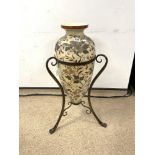 LARGE CERAMIC URN ON A WROUGHT IRON BASE WITH CLAW FEET, 80CMS