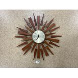 A MID-CENTURY STYLE TEAK STARBURST CLOCK