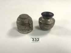 A TIBETAN WHITE METAL EMBOSSED DECORATED MIT BOX, 7CMS, AND A WHITE METAL VASE