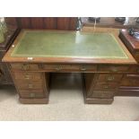 A LATE VICTORIAN RED WALNUT PEDESTAL DESK WITH NINE DRAWERS, 122 X 66CMS