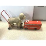 A VINTAGE SOFT PUSH ALONG DOG TOY, MADE IN IRELAND BY LINES BROTHERS LTD ADN A TOY PLASTIC DOUBLE