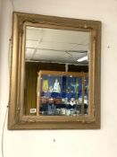 A RECTANGULAR GOLD-PLATED BEVELLED WALL MIRROR WITH MOULDED DECORATION, 80 X 66CMS