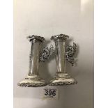 PAIR OF HALLMARKED SILVER CIRCULAR CHAMBERSTICKS, THE HANDLES FORMED AS DRAGONS, 11CM (HALLMARKED