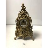 A 20TH CENTURY ORNATE BRASS FRENCH STYLE MANTLE CLOCK WITH ENAMEL NUMERALS, MOVEMENT MADE IN