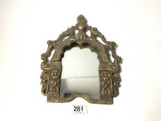 A VINTAGE TIBETAN BRONZE MIRROR FRAME DECOUNTED WITH FIGURES AND ANIMALS, 25 X 30CMS