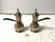 A PAIR OF HALLMARKED SILVER GEORGIAN DESIGN EMBOSSED CHOCOLATE POTS WITH EBONY HANDLES - SHEFFIELD
