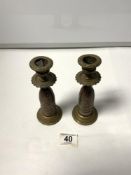 A PAIR OF TRENCH ART BULLIT CANDLESTICKS WITH ALBERT PLAQUES, 17CMS