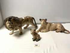 MELBA WARE CERAMIC FIGURES OF MALE LION, LIONESS, AND A CUB, THE LARGEST 36 X 20CMS