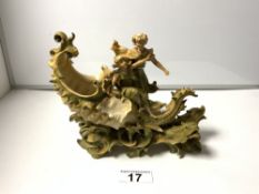 A PORCELAIN SHELL WITH FIGURES AND SEA SERPENT CENTRE PIECE IN THE MANNER OF ROYAL DUX A/F, 40 X