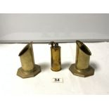 A 1942 TRENCH ART SHELL CASE TABLE LIGHTER, AND A PAIR OF SHELL VASES ON OCTAGONAL BASES