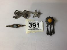 THREE ANTIQUE SILVER BROOCHES ONE WITH AMBER, AND ONE OTHER
