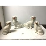 TWO PAIRS OF STAFFORDSHIRE POTTERY DOGS, THE TALLEST 30CMS