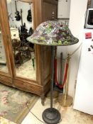 TIFFANY STYLE LAMP STAND WITH LEADED LIGHT COLOURED SHADE ON A BRONZE EFFECT COLUMN, 160CMS
