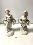 A PAIR OF LATE VICTORIAN PARIAN WARE FIGURES OF BOY AND GIRL CARRYING BASKETS, 37CMS (A/F)