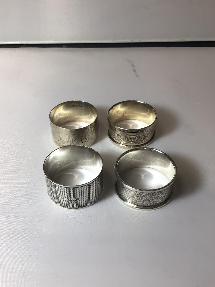 FOUR ENGINE TURNED HALLMARKED SILVER NAPKIN RINGS, 71 GRAMS