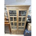 1930S OAK LEADED LIGHT FOUR-DOOR BOOKCASE WITH A CARVED FREEZE, 96 X 26 X 188CMS
