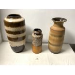 THREE 1960S WEST GERMAN POTTERY SLIP DECORATED VASES, THE TALLEST 46CMS