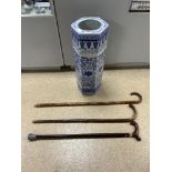 A 20TH CENTURY BLUE AND WHITE CHINESE HEXAGONAL STICK STAND AND THREE WALKING STICKS