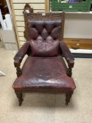 LATE VICTORIAN CARVED MAHOGANY AND LEATHER LIBRARY CHAIR