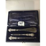 SET OF EMBOSSED STERLING SILVER HANDLED SHOE HORN, BUTTON HOOK, AND NAIL FILE (CASED)