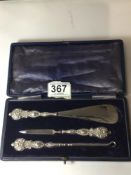 SET OF EMBOSSED STERLING SILVER HANDLED SHOE HORN, BUTTON HOOK, AND NAIL FILE (CASED)