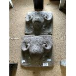 PAIR OF STONE GARDEN WALL PLAQUES OF RAM HEADS