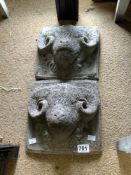 PAIR OF STONE GARDEN WALL PLAQUES OF RAM HEADS