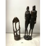 A TALL CARVED AFRICAN FIGURE, 59CMS AND A CARVED WOODEN AFRICAN SCULPTURE OF FIGURES