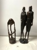 A TALL CARVED AFRICAN FIGURE, 59CMS AND A CARVED WOODEN AFRICAN SCULPTURE OF FIGURES
