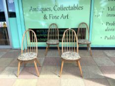 ERCOL - A SET OF FOUR QUAKER STYLE DINING CHAIRS IN LIGHTWOOD