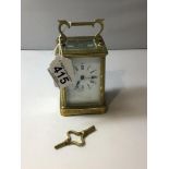 A FRENCH BRASS CARRIAGE CLOCK, WITH KEY