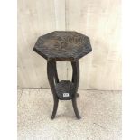 A SMALL TWO-TIER CARVED OCCASIONAL TABLE