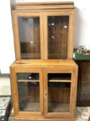 A TALL GLAZED PINE FOUR-DOOR BOOKCASE, 96 X 258CMS