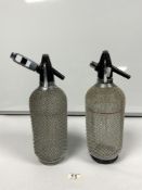 TWO VINTAGE DESIGN SODA SYPHONS WITH MESH COVERING