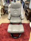 EKORNESS LEATHER SWIVEL EASY CHAIR AND MATCHING FOOTSTOOL