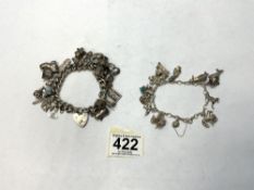 TWO HALLMARKED SILVER CHARM BRACELETS WITH 32 CHARMS, 111 GRAMS