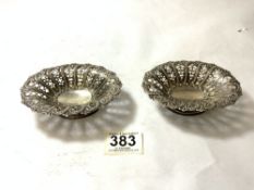 PAIR OF EDWARDIAN HALLMARKED SILVER PIERCED AND EMBOSSED OVAL PEDESTAL BON BON DISHES, 11.5CMS BY
