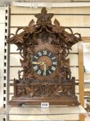 A 19TH CARVED OAK BLACK FOREST BRACKET CUCKOO CLOCK WITH CARVED LEAF AND GRAPE DECORATION - DOUBLE