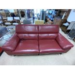 A LARGE RED LEATHER TWO SEATER ELECTRIC RECLINING SOFA WITH SQUARE CHROME LEGS, 220 X 94 X 94CMS