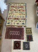 FIVE PERSIAN PRAYER RUGS AND A WALL HANGING WITH ANIMAL AND BUILDING DECORATION
