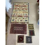 FIVE PERSIAN PRAYER RUGS AND A WALL HANGING WITH ANIMAL AND BUILDING DECORATION