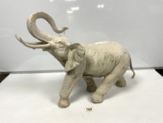 A PAINTED METAL FIGURE OF AN ELEPHANT, 42CMS