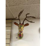 A DECOUPAGE MATERIAL WALL MOUNTED STAGS HEAD