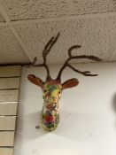 A DECOUPAGE MATERIAL WALL MOUNTED STAGS HEAD