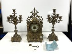 EARLY 20TH CENTURY FRENCH HIGHLY ORNATE BRASS CLOCK GARNITURE COMPRISING OF CLOCK AND A PAIR OF