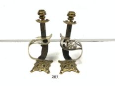 A PAIR OF SWORD GRIP AND GUARD CONVERTED TO CANDLESTICKS, 28CMS