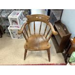 A LATE 19TH CENTURY ELM WOOD CAPTAINS CHAIR ON TURNED LEGS