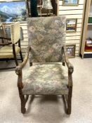 LOUIS XIII STYLE ELBOW CHAIR WITH CARVED LIONS HEAD ARMS AND NEEDLEPOINT UPHOLSTERY AND CROSS