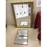 MODERN BEVELLED WALL MIRROR IN AN ORNATE GILT FRAME, 59 X 90CMS, AND A SMALL GILT FRAME WALL MIRROR