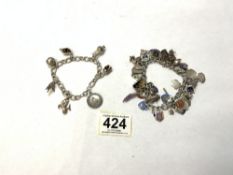 TWO CHARM BRACELETS ONE STERLING/WHITE METAL WITH 56 CHARMS, 102 GRAMS